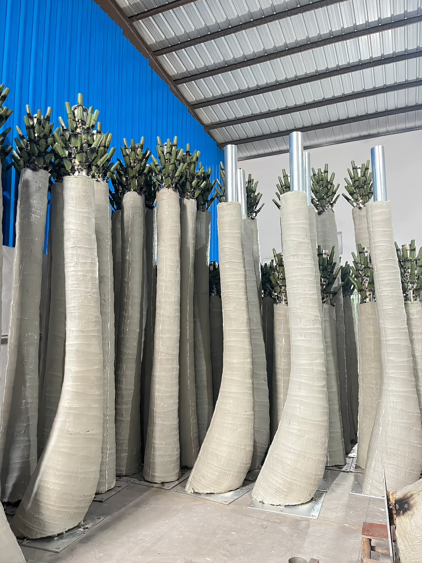 Finished trunks in stock, awaiting frond fitting